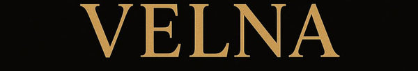 Velna Jewelry logo with a gold necklace on a black background